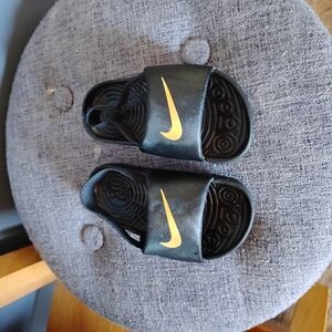 Nike Kids Black and Gold Slide Sandals